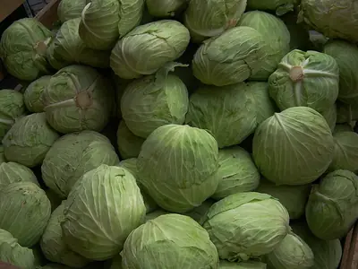 Heads of cabbage stacked for sale