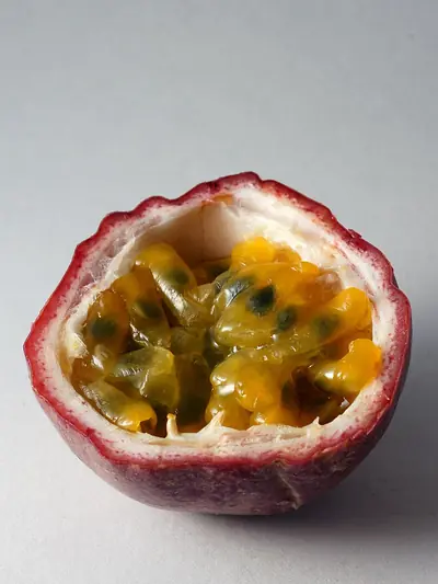 A purple passion fruit cut open