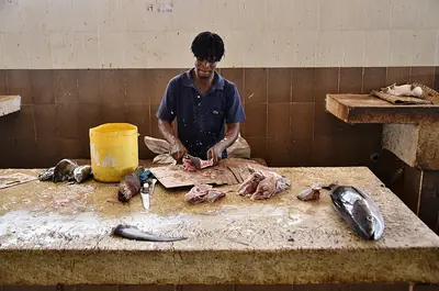 A fishmonger at work in Mombasa's fish market